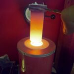 2 Thousand degree brass being prepared for casting Odin figurines.